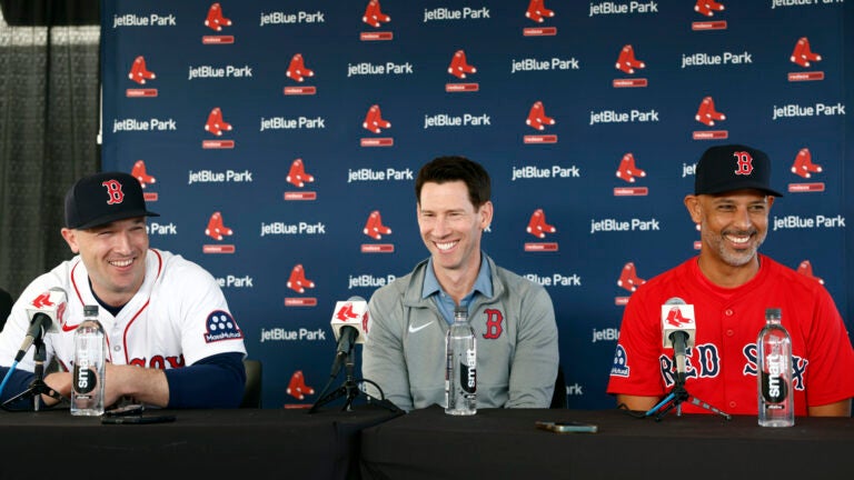 Boston Red Sox player Alex Bregman, Chief Baseball Officer Craig Breslow, and manager Alex Cora laugh during Bregman’s introductory press conference at JetBlue Park.