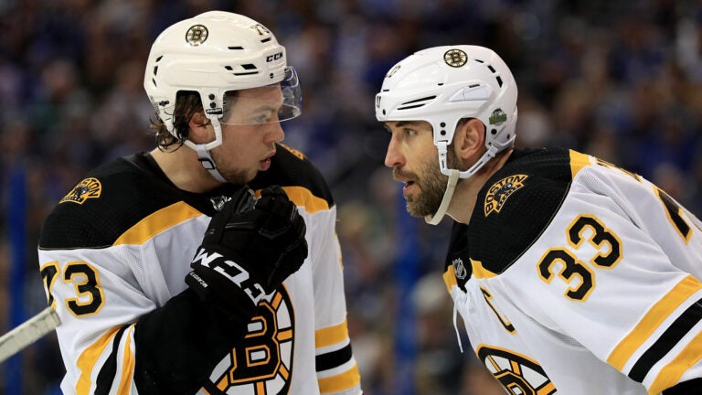 Zdeno Chara’s influence still looms large over Bruins’ Charlie McAvoy插图 Charlie McAvoy #73 and Zdeno Chara #33 of the Boston Bruins talk during Game Two of the Eastern Conference Second Round against the Tampa Bay Lightning during the 2018 NHL Stanley Cup Playoffs at Amalie Arena on April 30, 2018 in Tampa, Florida.