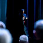 President Donald Trump takes the stage to address the Detroit Economic Club.