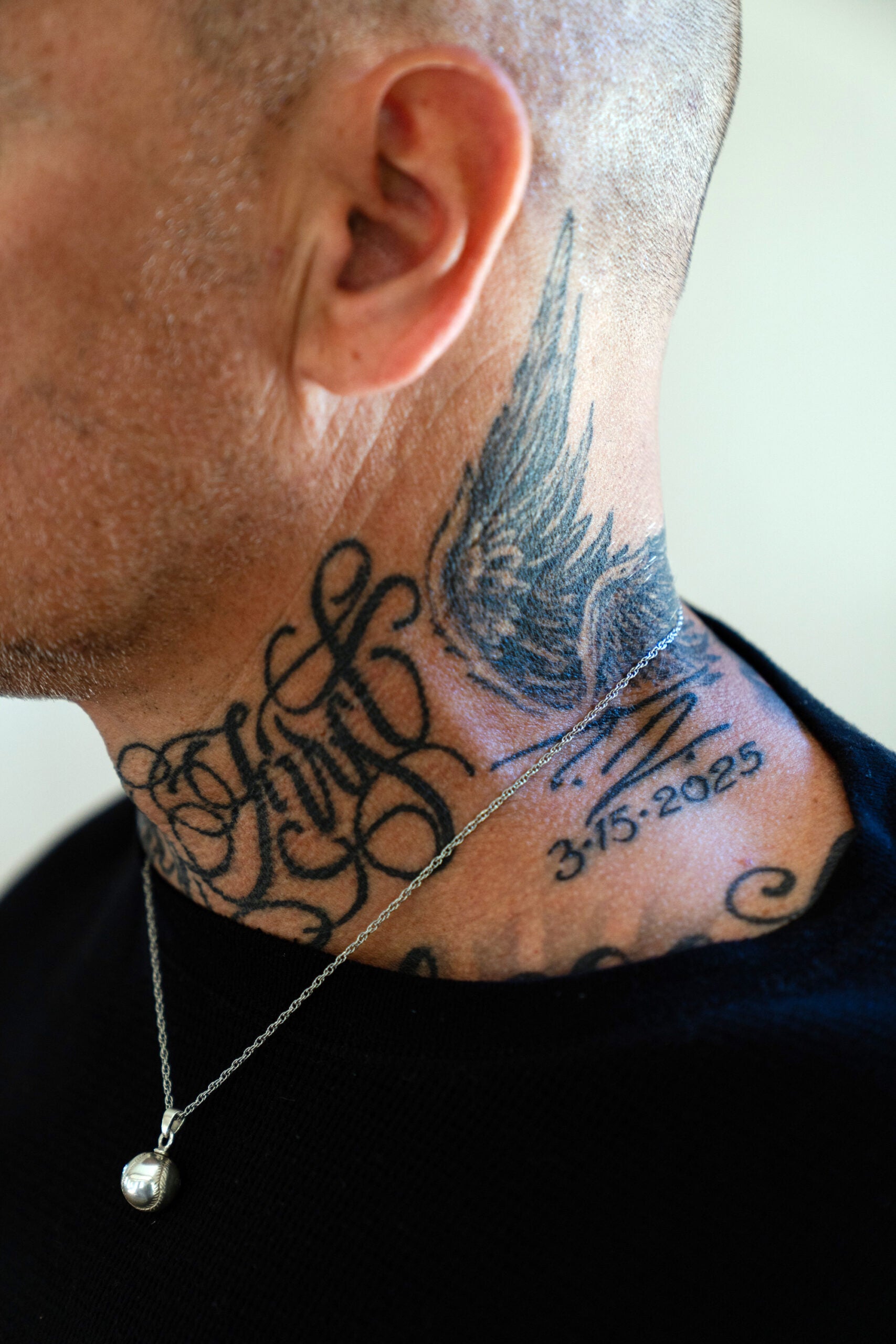 Timothy Kimball displays his tattoo, which memorializes his son, TJ Kimball. 