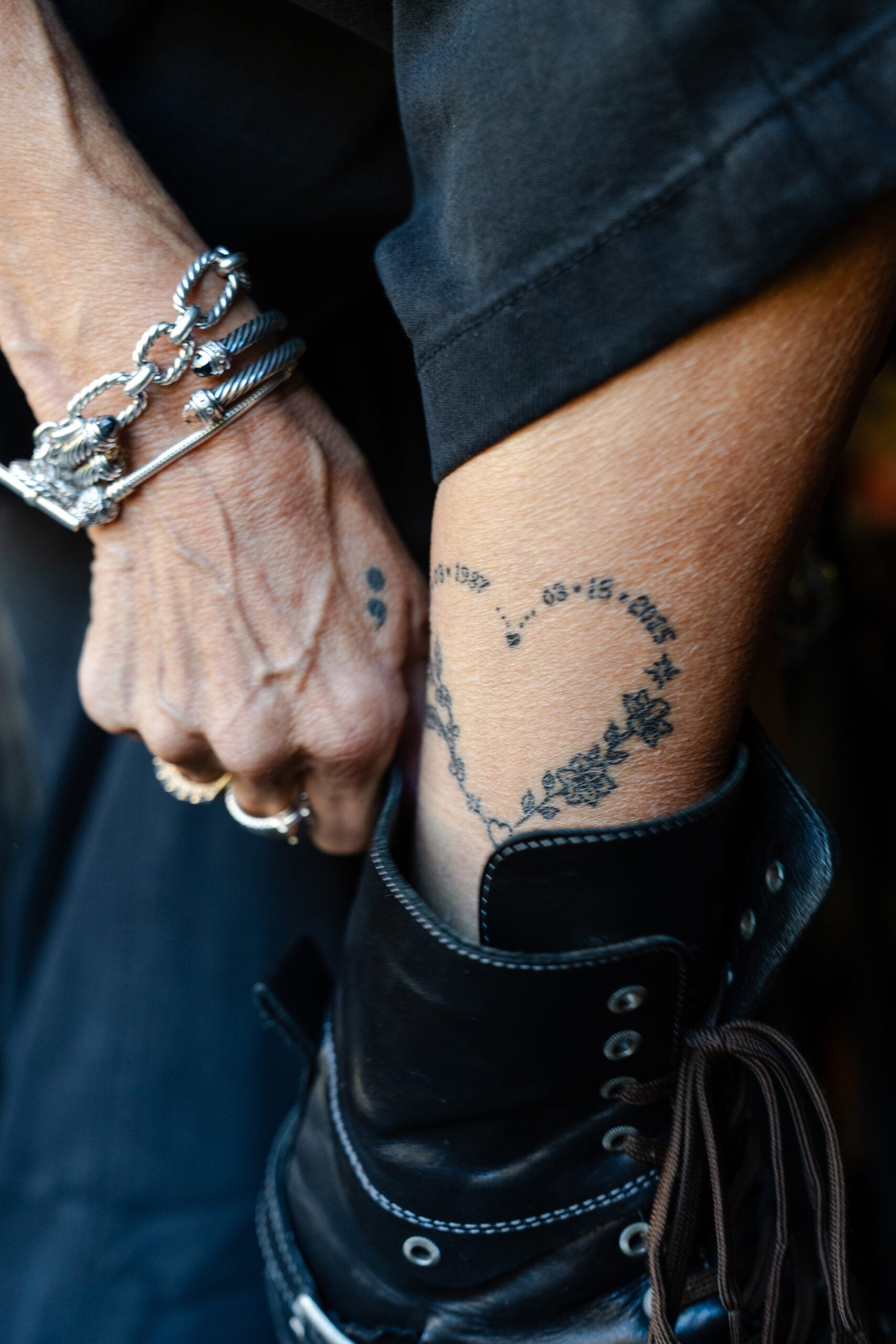 Angela Kimball displays the tattoo she got to memorialize her son, TJ Kimball, in Plymouth, Mass.