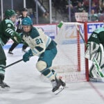 Former Fleet player Hilary Knight (21), center, of the Seattle Torrent, and, from left, US Olympians, Megan Keller (5) Goalie Aerin Frankel (31), of the Fleet net at the Agganis Arena on Jan. 7 2026.
