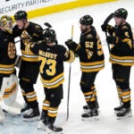 Boston Bruins goaltender Jeremy Swayman (1) and teammates celebrate his 3-0 shutout during the 3rd period. The Boston Bruins host the Detroit Red Wings Tuesday, January 13, 2026 at TD Garden in Boston, MA.