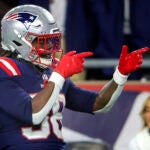New England Patriots running back Rhamondre Stevenson #38 reacts after a 20 yard rushing gain against the Miami Dolphins during third quarter NFL action at Gillette Stadium on January 4, 2025.