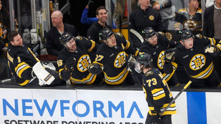 Boston MA 1/22/26 Boston Bruins defenseman Charlie McAvoy (73) celebrates his goal with his teammates on the bench against the Las Vegas Golden Knights during first period NHL action at TD Garden on January 22, 2026.