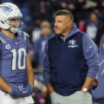 New England Patriots quarterback Drake Maye #10 talking to head coach Mike Vrabel wearing their Nor’easter uniforms before they play the New York Jets. The New England Patriots played the New York Jets at Gillette Stadium on November 13, 2025.