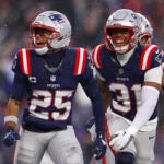 New England Patriots cornerback Marcus Jones (25) celebrates after intercepting a pass during the second quarter. The New England Patriots played the Houston Texans in the NFL divisional round playoff game at Gillette Stadium on January 18, 2026.