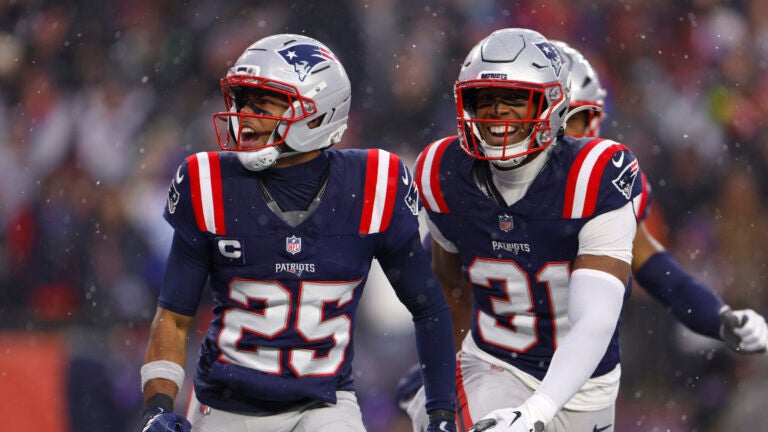 New England Patriots cornerback Marcus Jones (25) celebrates after intercepting a pass during the second quarter. The New England Patriots played the Houston Texans in the NFL divisional round playoff game at Gillette Stadium on January 18, 2026.