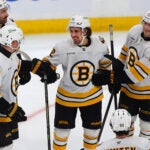 Bruins Bruins Henri Jokiharju(left) and Alex Steeves(right) congratulate Marat Khusnutdinov (c) after Marat scored his 4th goalcoming in the 3rd period.