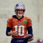 The NE Patriots held practice inside the Gillete stadium practice bubble. QB Drake Maye smiles during a passing drill.