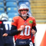 The NE Patriots held practice at Gillette Stadium. QB Drake Maye runs during warmups.