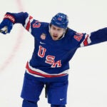 United States' Quinn Hughes celebrates after scoring the winning goal against Sweden during the overtime period of a men's ice hockey quarterfinal game at the 2026 Winter Olympics, in Milan, Italy, Wednesday, Feb. 18, 2026.
