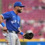 Toronto Blue Jays' Isiah Kiner-Falefa smiles between batters in the second inning of a baseball game against the Cincinnati Reds, Tuesday, Sept. 2, 2025, in Cincinnati.