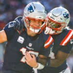 New England Patriots quarterback Drake Maye (10) celebrates with wide receiver Stefon Diggs (8) after a touchdown during the second half of an NFL football game against the Cleveland Browns, Sunday, Oct. 26, 2025, in Foxborough, Mass.