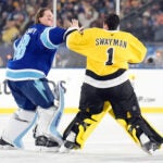 Tampa Bay Lightning goaltender Andrei Vasilevskiy (88) and Boston Bruins goaltender Jeremy Swayman (1) fight during the second period of a Stadium Series NHL hockey game Sunday, Feb. 1, 2026, in Tampa, Fla.