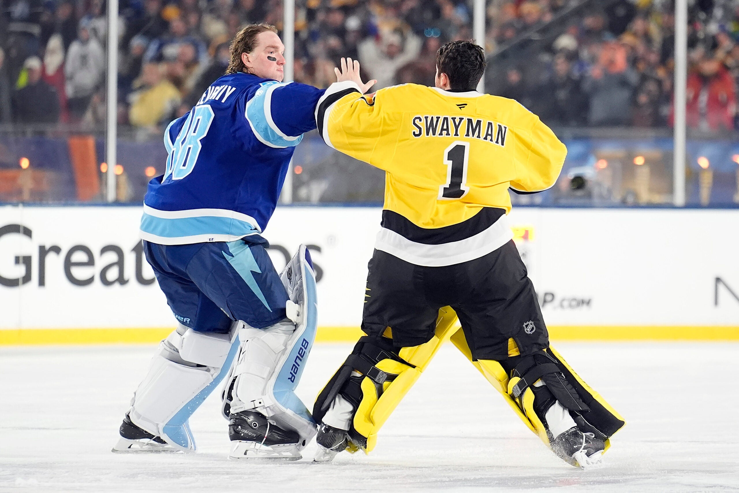 boston.com - Conor Ryan - Bruins' Jeremy Swayman gets into goalie fight with Andrei Vasilevskiy in outdoor game