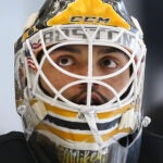 The Bruins training camp continued on Thursday at Warrior Ice Arena. Goalie Michael DiPietro lookls up during a break.