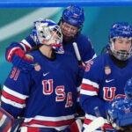 United States goalkeeper Aerin Frankel (31) is congratulated by Kelly Pannek (12) after a 5-0 win over Sweden in a women's ice hockey semifinal match at the 2026 Winter Olympics, in Milan, Italy, Monday, Feb. 16, 2026.