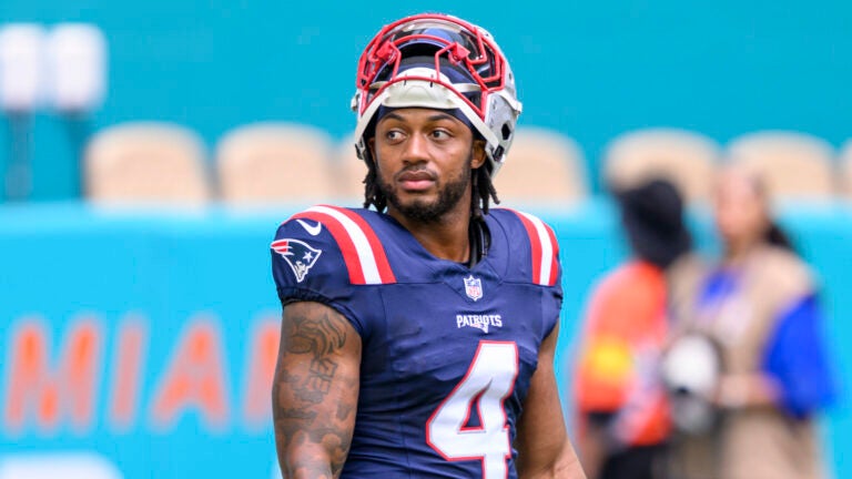 New England Patriots running back Antonio Gibson (4) stands on the field before an NFL football game against the Miami Dolphins, Saturday, Sept. 14, 2025, in Miami Gardens, Fla.