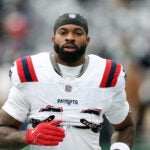 New England Patriots linebacker K'lavon Chaisson (44) reacts before an NFL football game against the New York Jets, Sunday, Dec. 28, 2025, in East Rutherford, N.J.