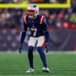 New England Patriots cornerback Carlton Davis III (7) drops into coverage during the first half of an NFL divisional playoff football game against the Houston Texans, Sunday, Jan. 18, 2026, in Foxborough, Mass.