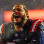 New England Patriots defensive tackle Cory Durden (94) reacts after defeating the Houston Texans in an NFL divisional playoff football game, Sunday, Jan. 18, 2026, in Foxborough, Mass.