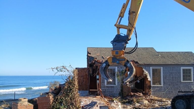 Cape Cod house with Watergate ties falls victim to eroding bluff