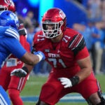 Utah offensive lineman Caleb Lomu (71) prepares to block BYU defensive end Anisi Purcell (94) during the first half of an NCAA college football game, Saturday, Oct. 18, 2025, in Provo, Utah.