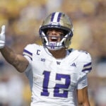 Washington wide receiver Denzel Boston reacts during an NCAA football game on Saturday, Oct. 18, 2025, in Ann Arbor, Mich.