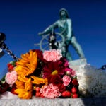 Flowers rest Sunday at the Gloucester Fisherman's Memorial to honor the seven crew members who perished.