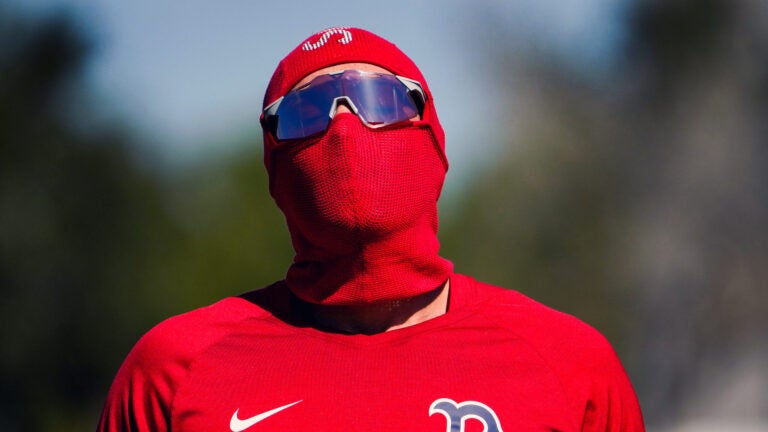 Boston Red Sox first baseman Triston Casas (36) wore a protective coverup from the suns rays. Casas was in camp early before position players are required to report for Boston Red Sox Spring Training at Jet Blue Park in Fort Myers, FL.