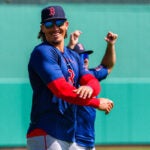 Boston Red Sox left fielder Jarren Duran (16) warming up before fielding drills. Day 7 of Boston Red Sox Spring Training at Jet Blue Park in Fort Myers, FL.