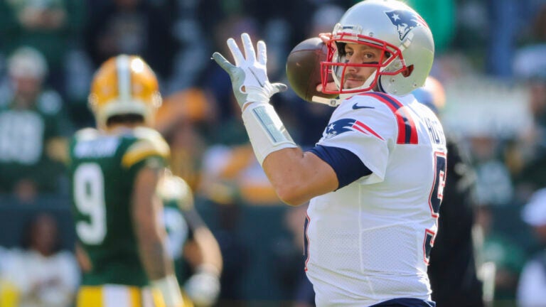 New England Patriots starting quarterback Brian Hoyer warms up before they play the Green Bay Packers during NFL action at Lambeau Field.