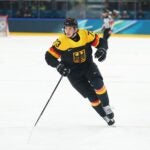 MILAN, ITALY - FEBRUARY 14: Lukas Reichel #73 of Team Germany skates in the third period during the Men's Preliminary Group C match between Germany and Latvia on day eight of the Milano Cortina 2026 Winter Olympic games at Milano Rho Ice Hockey Arena on February 14, 2026 in Milan, Italy.