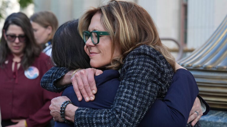 Laura Marquez-Garrett, attorney for SMVLC (Social Media Victims Law Center), embraces Julianna Arnold.