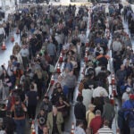 Travelers line up at a TSA checkpoint at George Bush Intercontinental Airport in Houston.