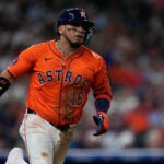 Houston Astros' Isaac Paredes runs to first after hitting a single during the seventh inning of a baseball game against the Texas Rangers, July 11, 2025, in Houston.