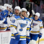 St. Louis Blues center Robert Thomas reacts after scoring an empty-net goal during the third period of an NHL hockey game against the Minnesota Wild, Sunday, March 1, 2026, in St. Paul, Minn.
