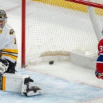Montreal Canadiens' Cole Caufield (13) scores on Boston Bruins goaltender Jeremy Swayman (1) during overtime NHL hockey action in Montreal on Tuesday, March 17, 2026.