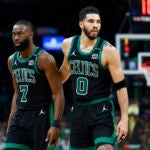 Boston Celtics forward Jayson Tatum (0) walks off the court with Boston Celtics guard Jaylen Brown (7) during the third quarter in Game 2 of the NBA Finals. The Boston Celtics hosted the Dallas Mavericks at TD Garden on Sunday, June 9, 2024.