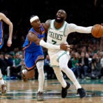 Oklahoma City Thunder guard Shai Gilgeous-Alexander (2) fouls Boston Celtics guard Jaylen Brown (7) during the fourth quarter at TD Garden on March 25, 2026 in Boston.