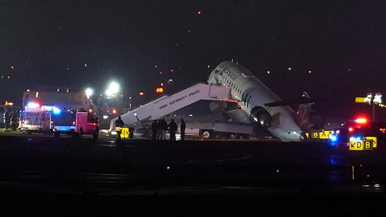 Pilot and copilot killed in collision between jet and fire truck at New York's LaGuardia Airport