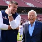 STANFORD, CALIFORNIA - FEBRUARY 07: Head coach Mike Vrabel of the New England Patriots talks with team owner Robert Kraft before taking a team photo prior to Super Bowl LX at Stanford Stadium on February 07, 2026 in Stanford, California.