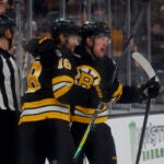 Boston Bruins centers Pavel Zacha (18) and Casey Mittelstadt (11) celebrate a goal against the Pittsburgh Penguins during the first period at TD Garden on March 3, 2026 in Boston.