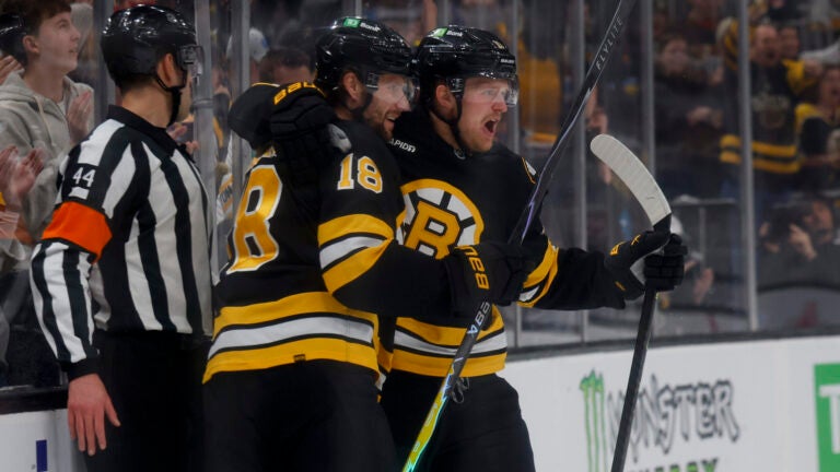 Boston Bruins centers Pavel Zacha (18) and Casey Mittelstadt (11) celebrate a goal against the Pittsburgh Penguins during the first period at TD Garden on March 3, 2026 in Boston.