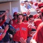 Boston Red Sox Roman Anthony is greeted in the dugout after scoring in the fourth inning of a spring training baseball game against the Minnesota Twins in Fort Myers, Fla., Wednesday, Feb. 25, 2026.