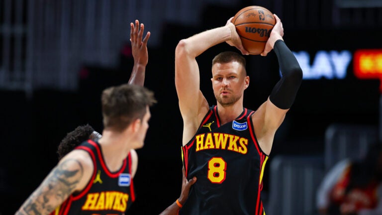 Atlanta Hawks center Kristaps Porzingis (8) looks to pass during the first half of an NBA basketball game against the Minnesota Timberwolves, Wednesday, Dec. 31, 2025, in Atlanta.
