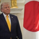 President Donald Trump listens as Japan's Prime Minister Sanae Takaichi speaks during a dinner in the State Dining Room of the White House.