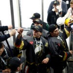 Blackstone Valley’s Colin Dorgan fist-bumps people on the way into the tunnel after defeating Lincoln in quadruple overtime for the Division 2 boys’ hockey championship at the Amica Mutual Pavilion on March 18, 2026 in Providence.