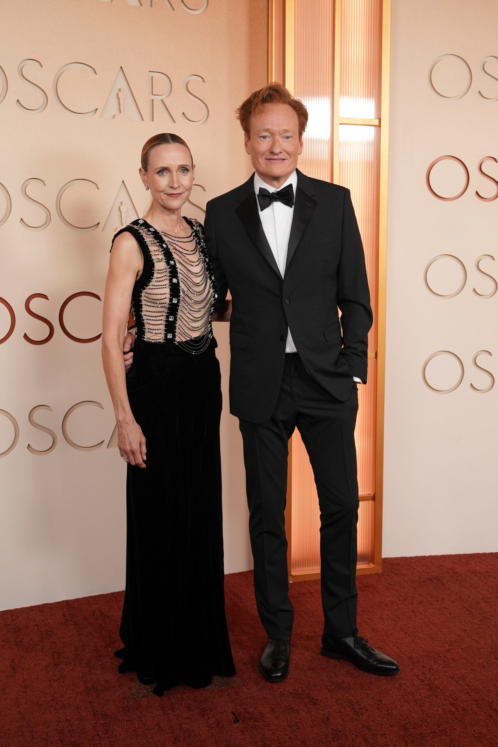 Liza Powel O'Brien, left, and Conan O'Brien arrive at the Oscars on Sunday, March 15, 2026, at the Dolby Theatre in Los Angeles.